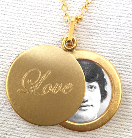 Love Round Slide Locket Necklace. Closeup showing open locket and photo