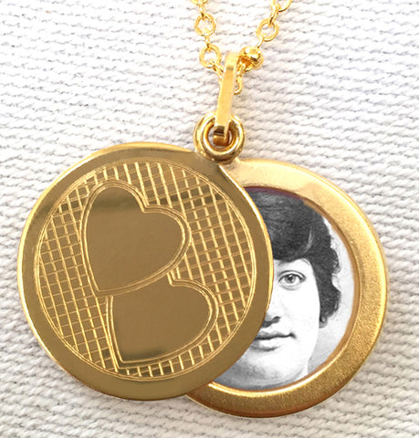 Two Hearts Beat as One Round Slide Locket Necklace. Closeup showing open locket with photo.